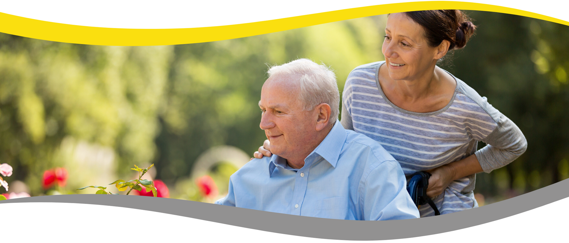 A nurse is helping an elderly man in a wheelchair.