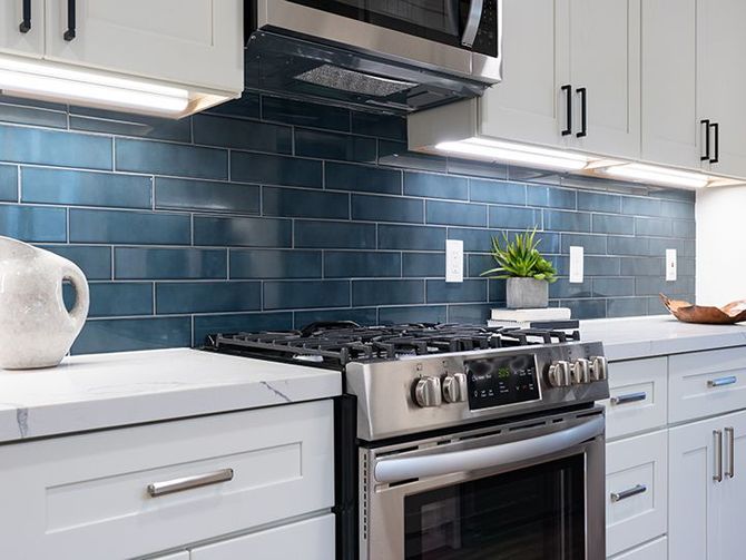 Modern kitchen details of white marble counter