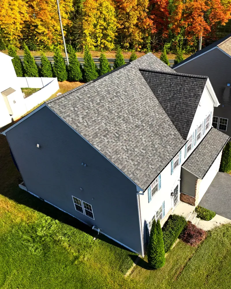 Two-story home in Havre de Grace, MD with a newly installed gray asphalt shingle roof