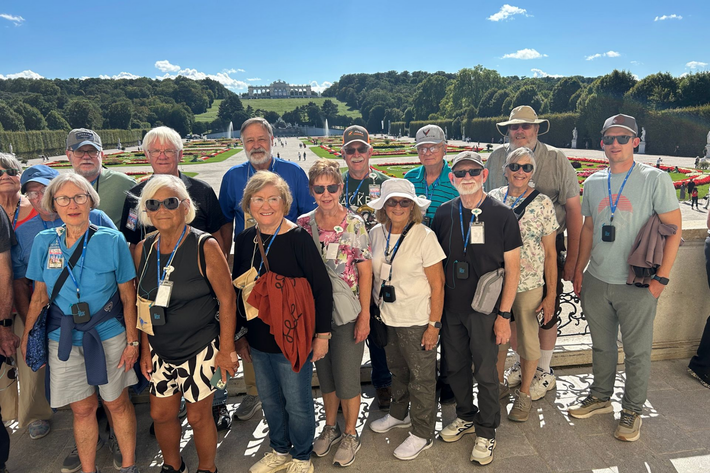 People posing in a photo frame at