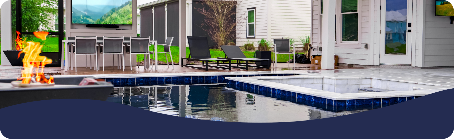 Luxury backyard patio with a pool, hot tub, fire pit, outdoor dining, and TV, set against a house.