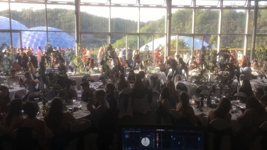 Guests sitting at the wedding tables at Eden Project