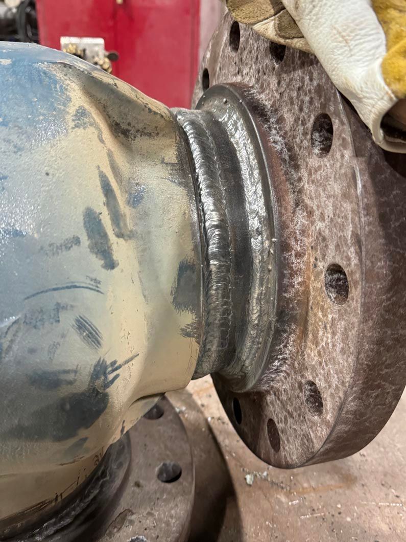 A close up of a piece of metal with a flange on it.