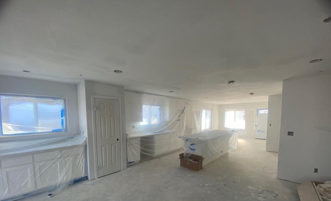 A large room in a house that is being remodeled.