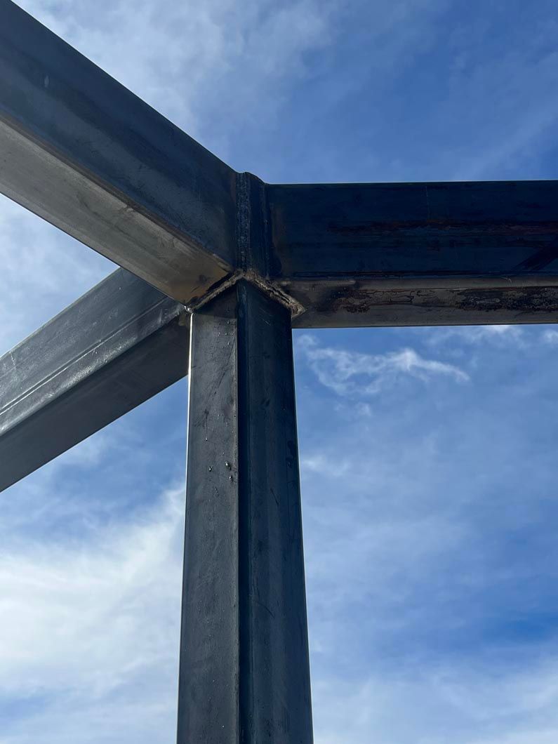 A metal structure with a blue sky in the background