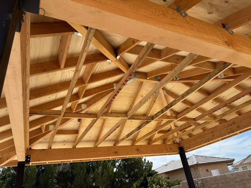 The ceiling of a wooden structure is being built.