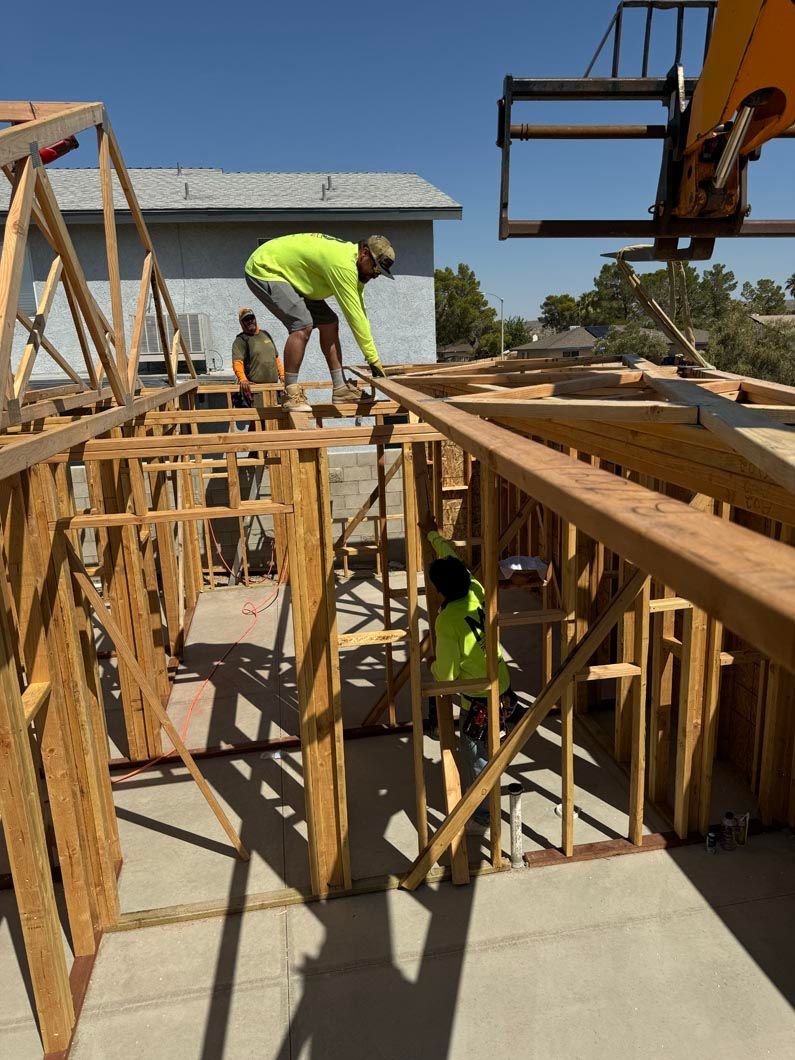 A group of construction workers are working on a wooden structure.