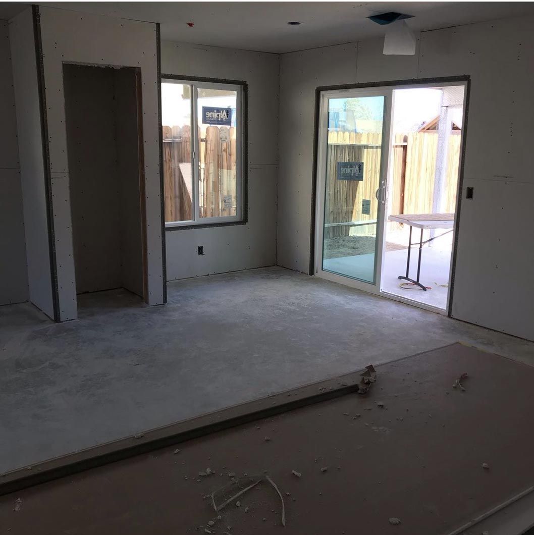 An empty room with a sliding glass door