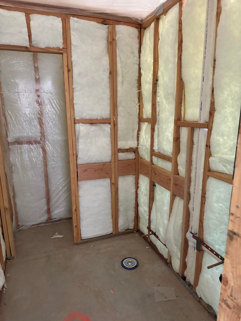 A room with foam insulation on the walls and floor.