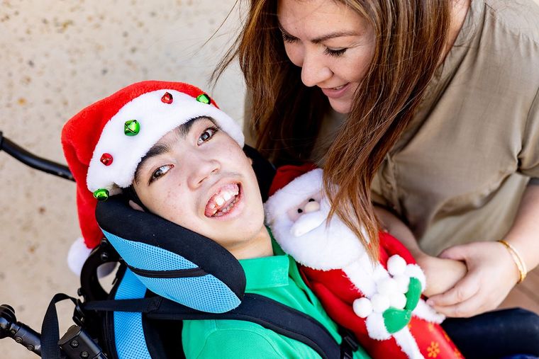 Two people smiling in santa hat - Ladina Photography 