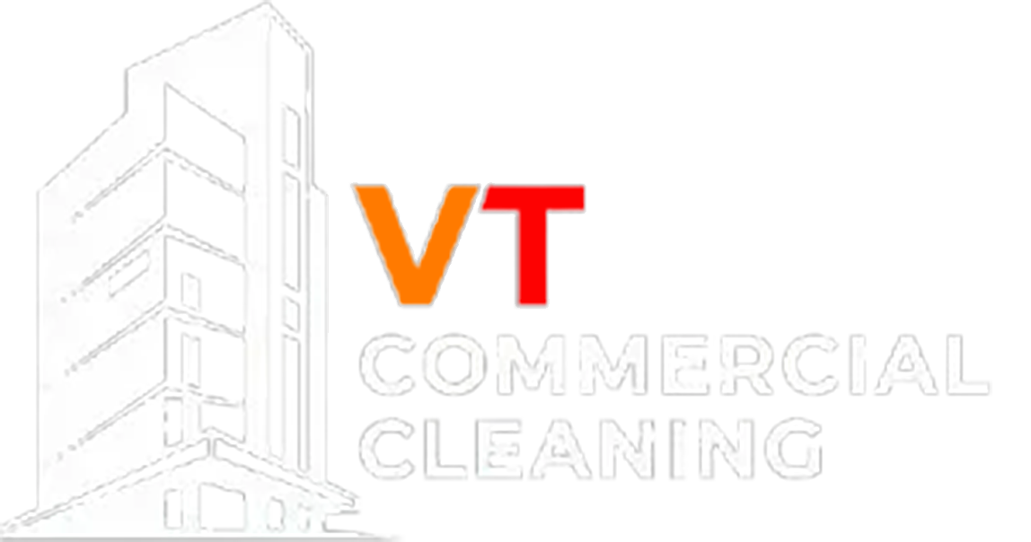 White outline of a building with "VT COMMERCIAL CLEANING" text.