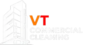 White outline of a building with "VT COMMERCIAL CLEANING" text.