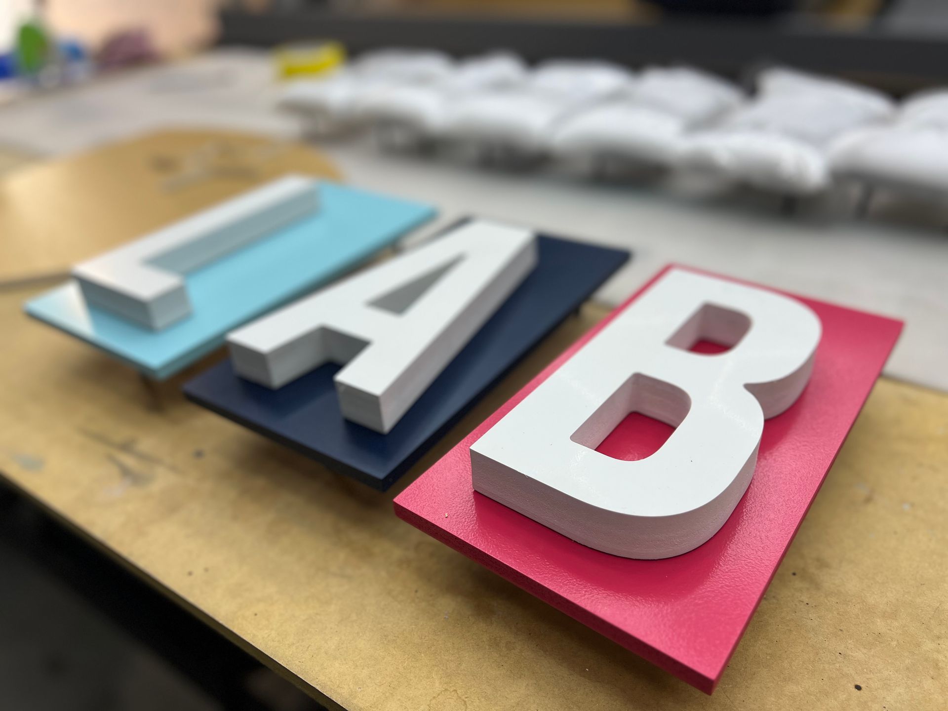 The Letters LAB are Sitting on a Wooden Table — Metric CNC In Morisset, NSW