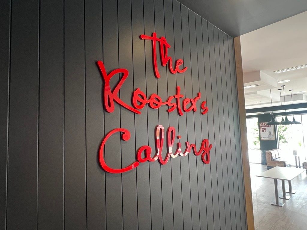 A Black Wall with a Red Sign — Metric CNC In Morisset, NSW