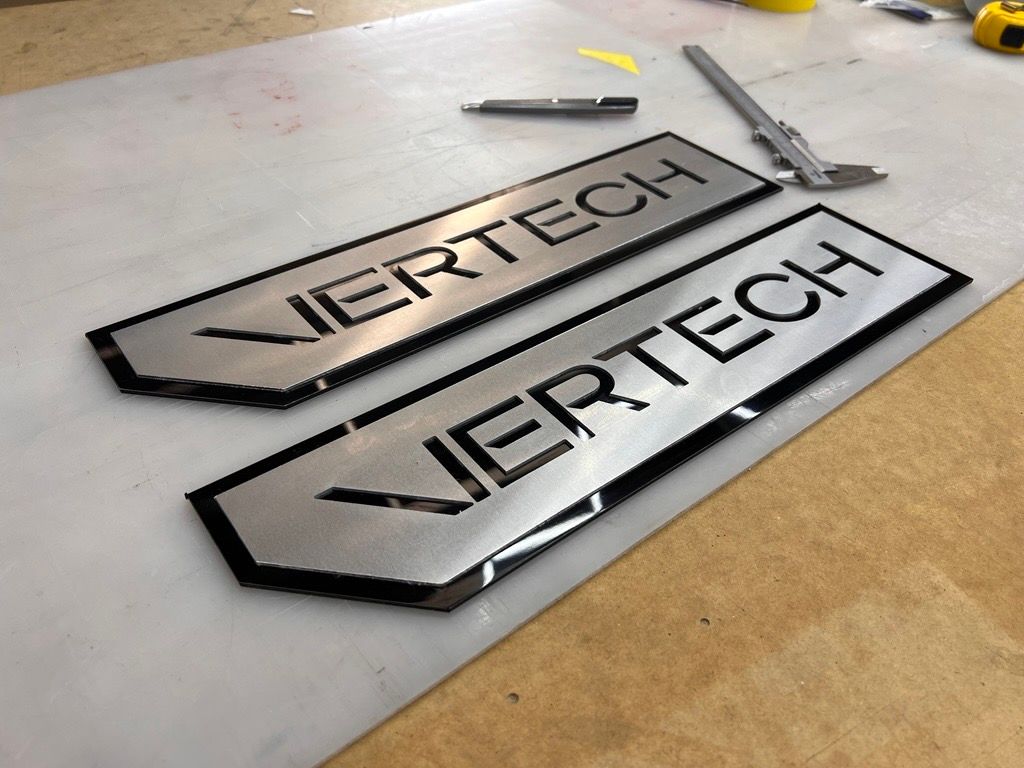 Two Pieces of Metal with the Word Vertech — Metric CNC In Morisset, NSW