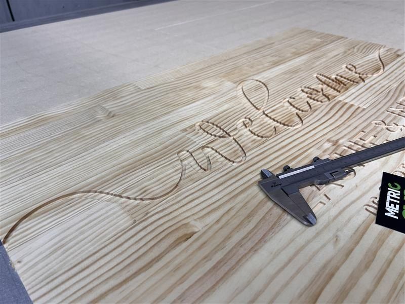 A Measuring Device is Sitting on a Piece of Wood — Metric CNC In Morisset, NSW
