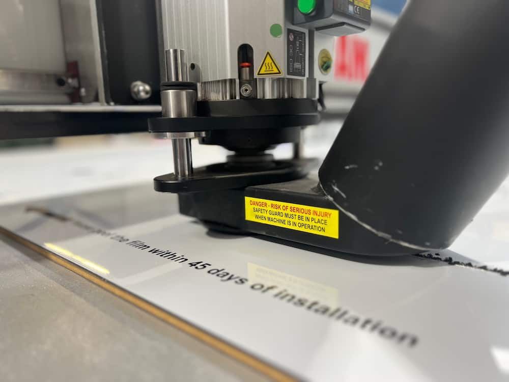 A Machine Is Cutting A Piece Of Metal — Metric CNC In Morisset, NSW