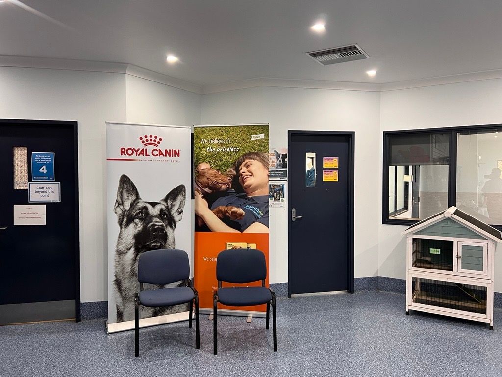 A Waiting Room with Chairs and a Sign — Metric CNC In Morisset, NSW