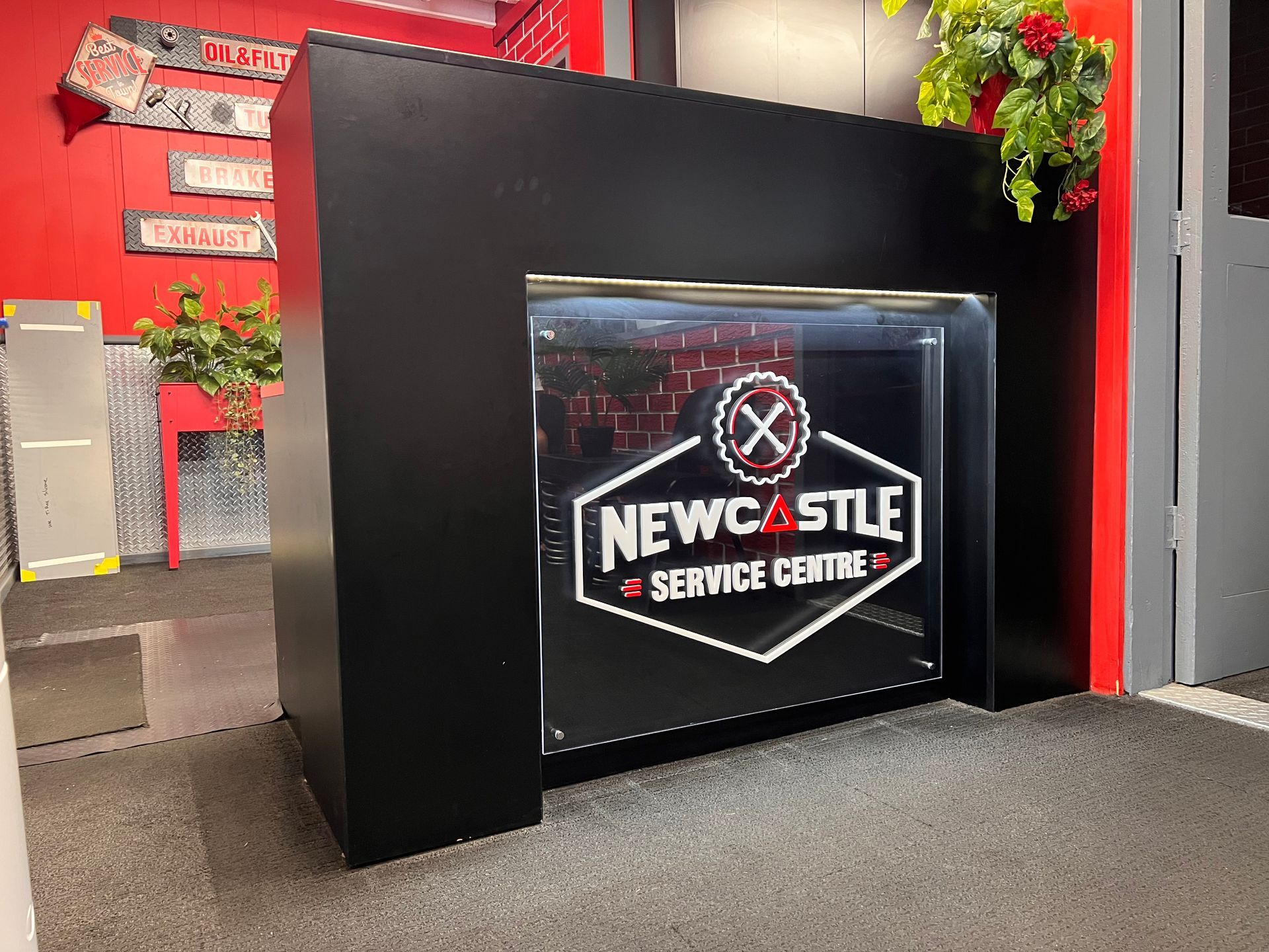 A Machine Is Engraving The Word Laser On A Piece Of Metal — Metric CNC In Morisset, NSW