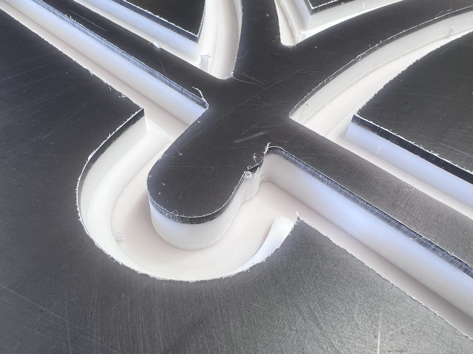 A Close Up Of A Piece Of Metal That Looks Like A Cross — Metric CNC In Morisset, NSW