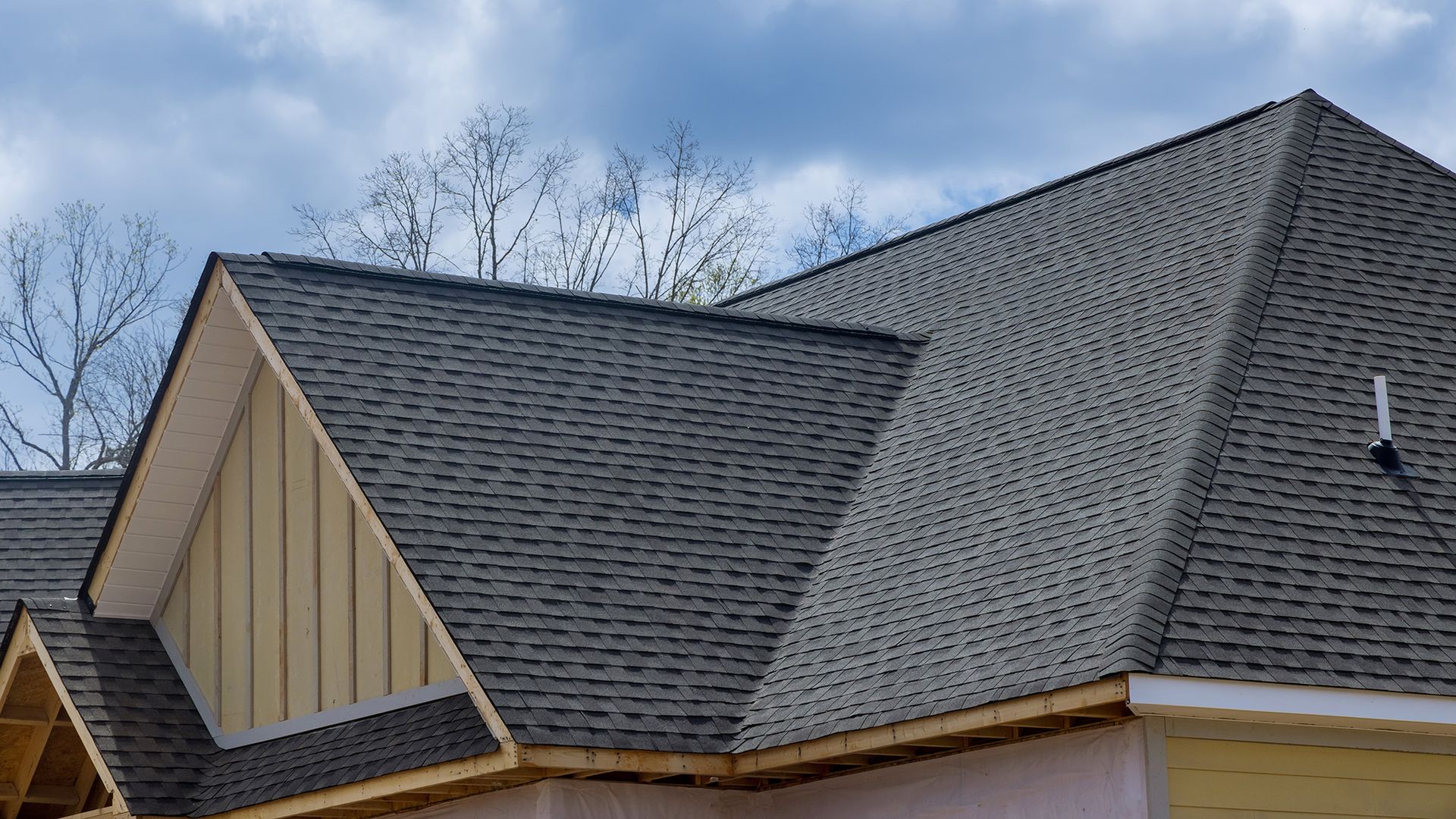 a close up of a roof of a house under construction .