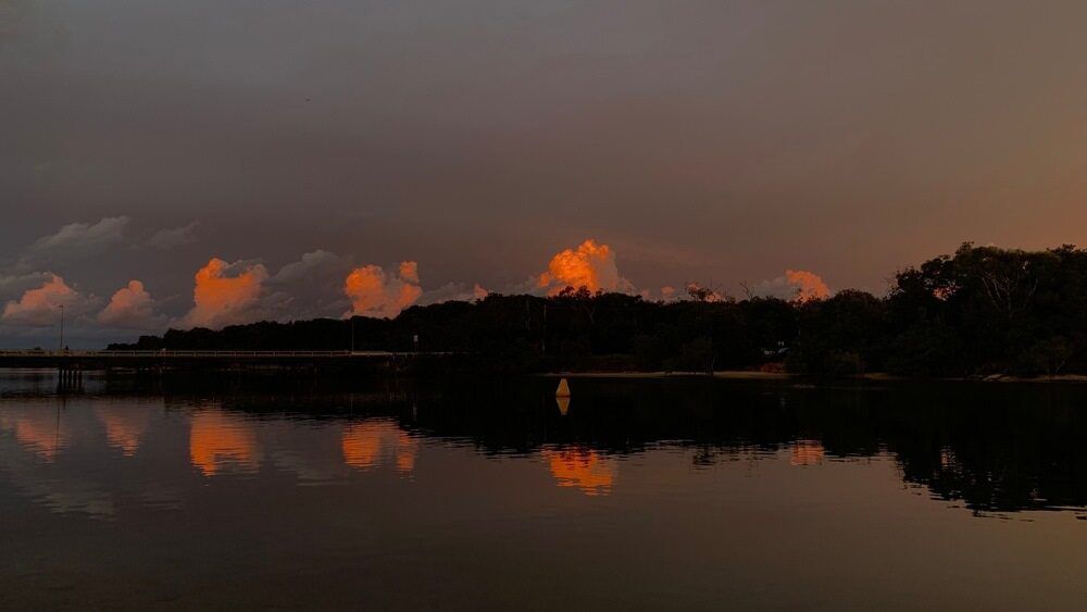 A Sunset Over A Lake With Trees In The Foreground — Kingscliff Tweed Coast Taxis Pty Ltd In Pottsville, NSW