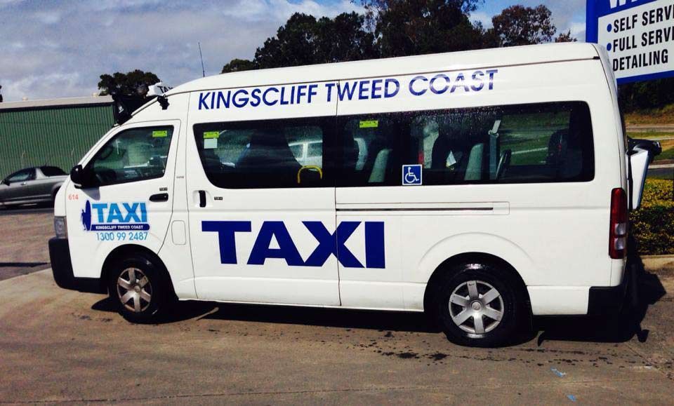 A Taxi Sign On Top Of A Car In A City — Kingscliff Tweed Coast Taxis Pty Ltd In Kingscliff, NSW
