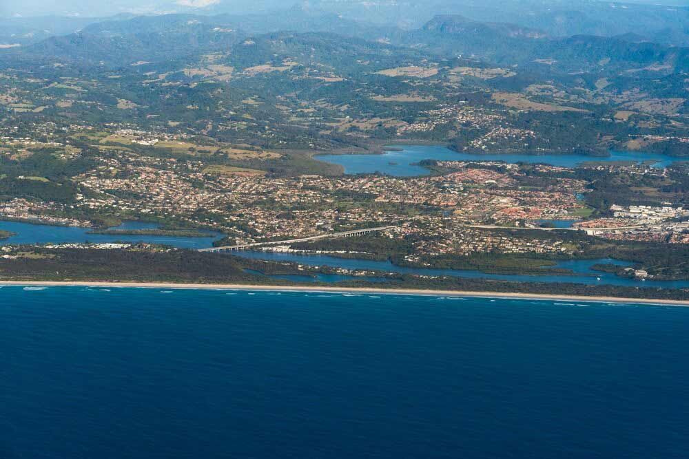 An Aerial View Of A City Surrounded By Water And Mountains — Kingscliff Tweed Coast Taxis Pty Ltd In Banora Point, NSW