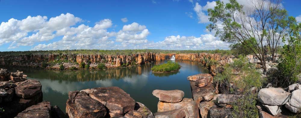 A Large Body Of Water Surrounded By Rocks And Trees — Kingscliff Tweed Coast Taxis Pty Ltd In Casuarina, NSW