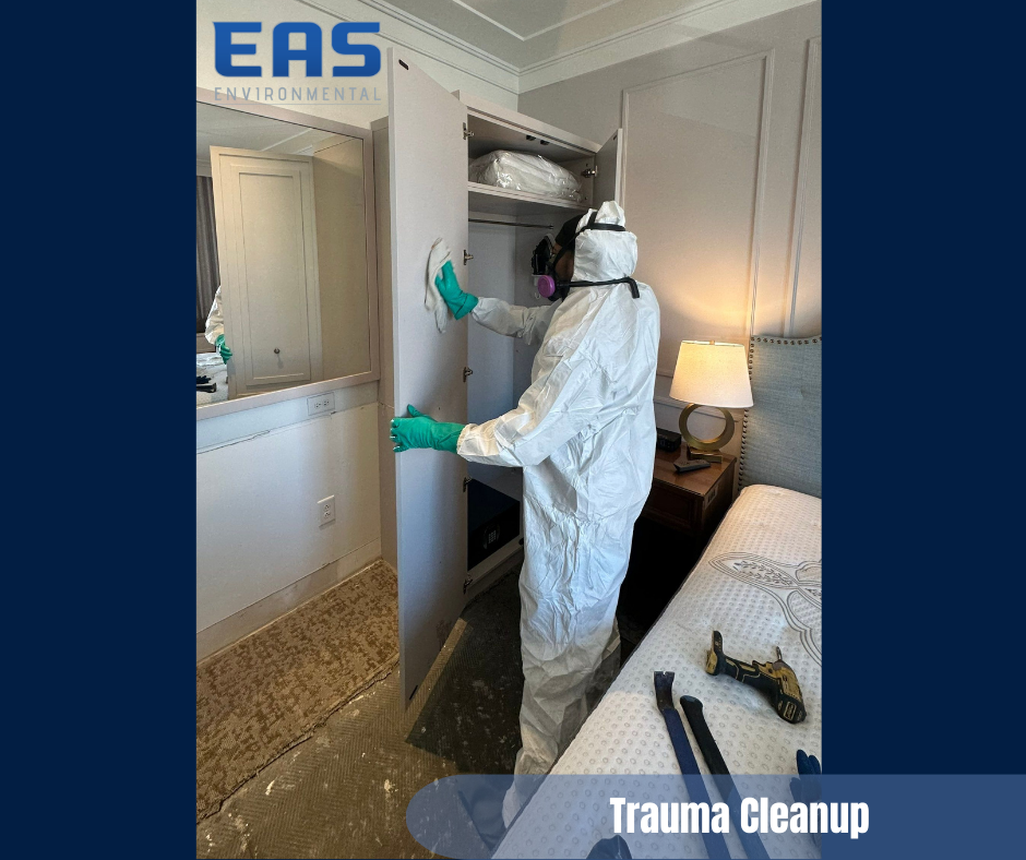Person in hazmat suit cleans a closet in a bedroom. The scene shows trauma cleanup.
