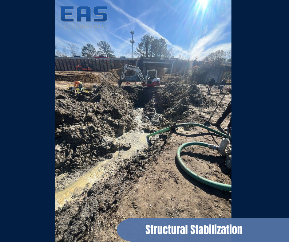 Person in protective suit sprays a wall in a room, mold remediation.
