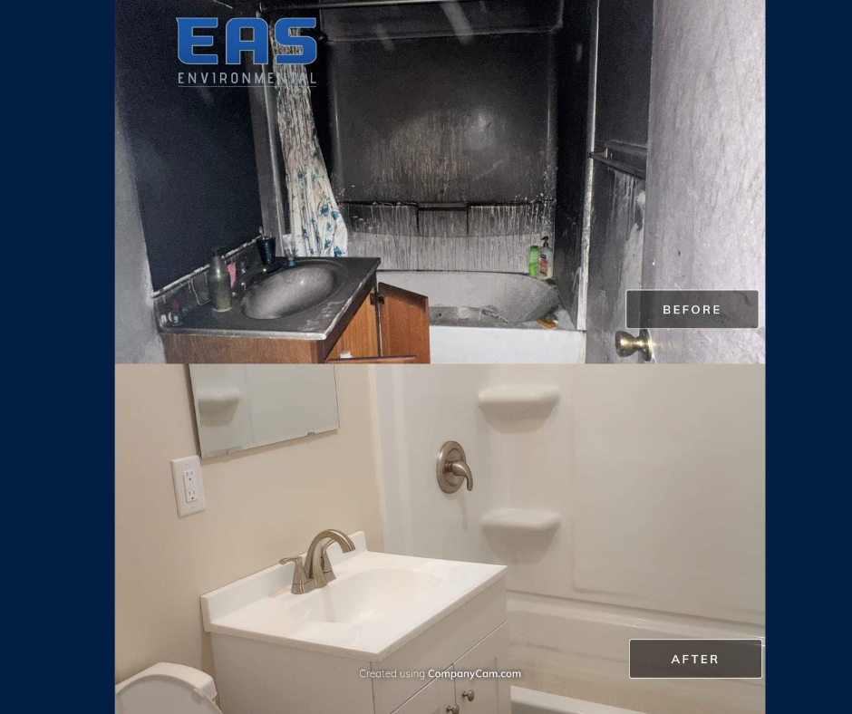 Workers in safety gear on a roof removing material with abatement equipment; urban setting with buildings in background.