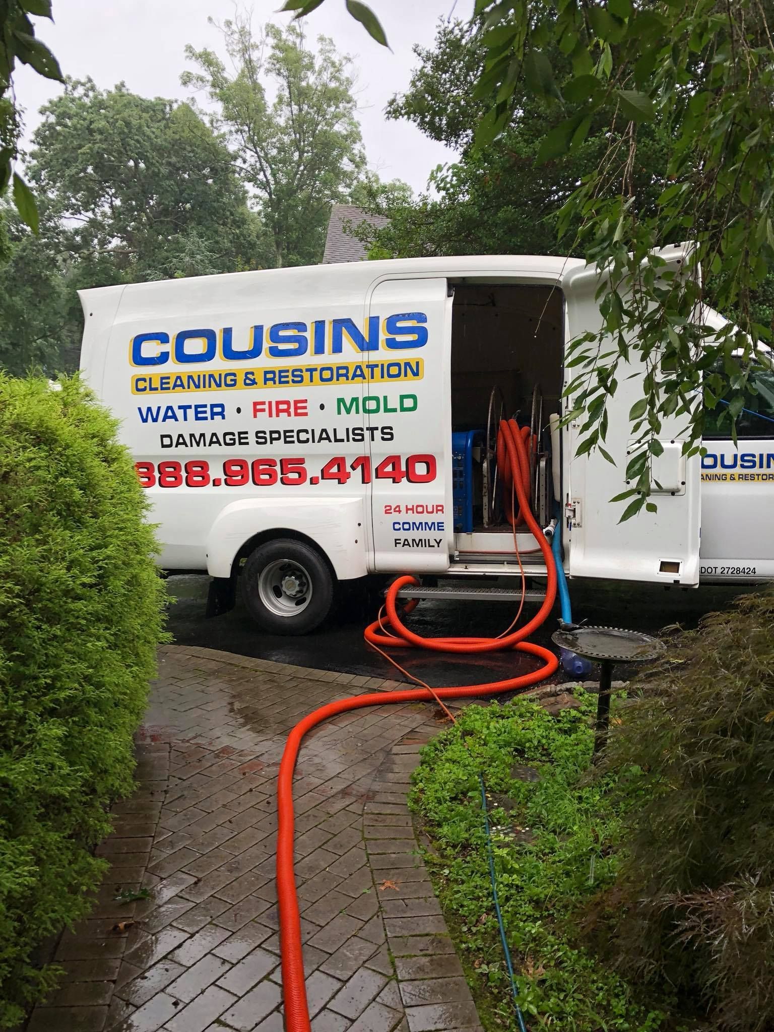 A white van with the word cousins on it