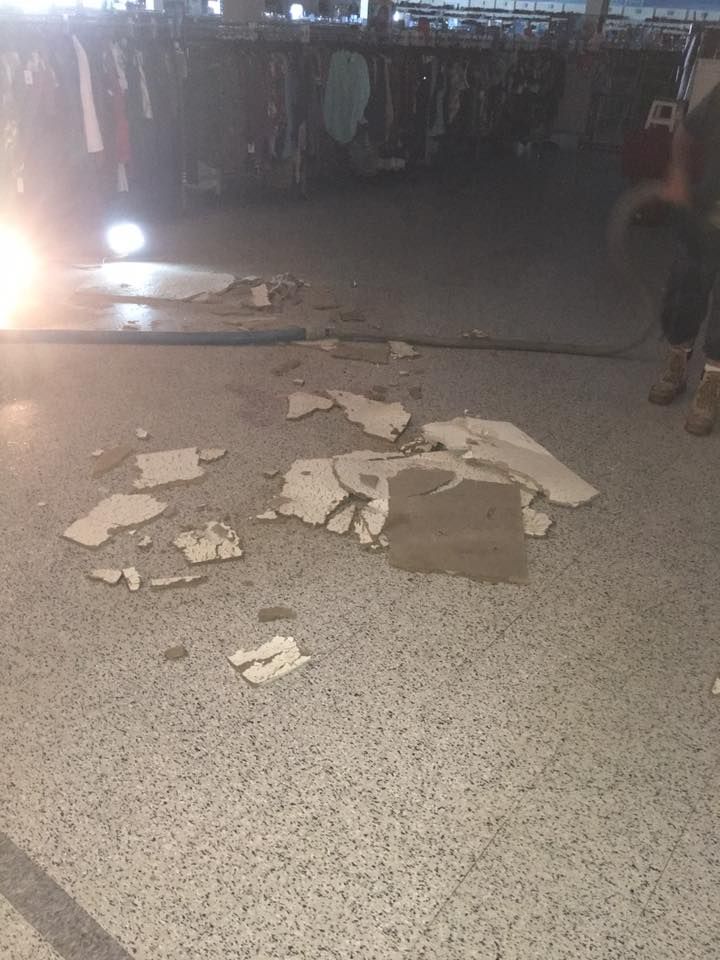A concrete floor with a lot of pieces of concrete on it.