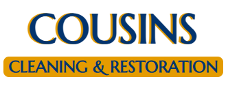 A blue and yellow logo for cousins cleaning and restoration