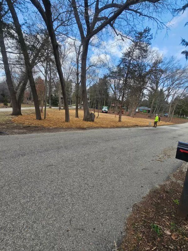 There is a mailbox on the side of the road.