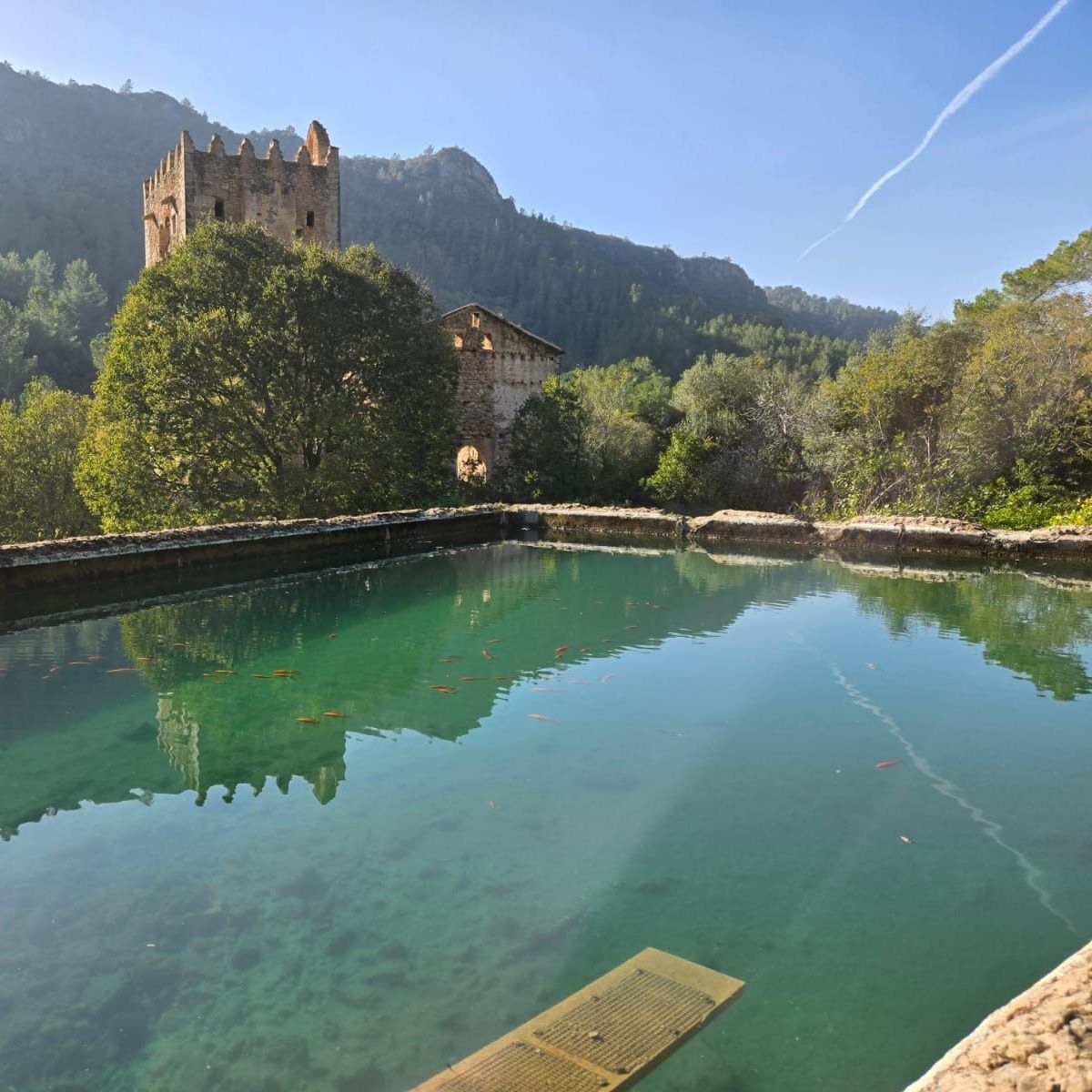 A large body of water with a castle in the background