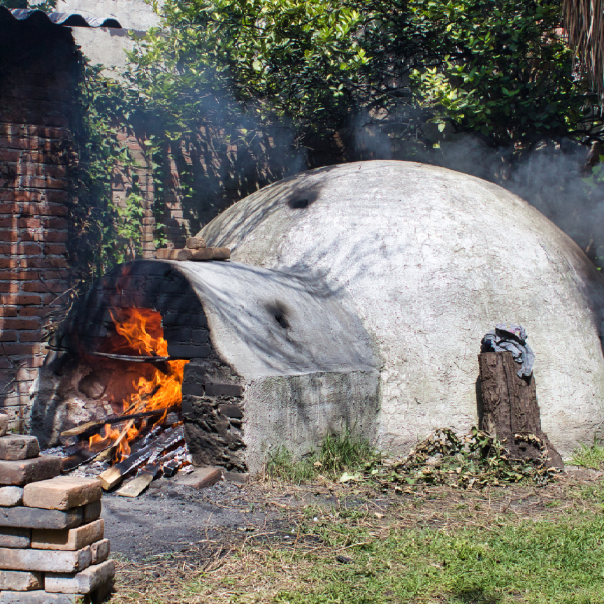 A large dome with a fire inside of it