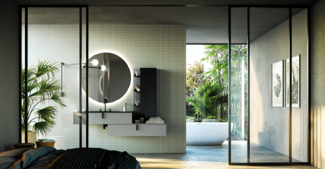 Bagno moderno con mobile, specchio rotondo con luce e lavandino nero.