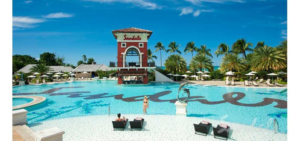 A large swimming pool with the word sandals on it
