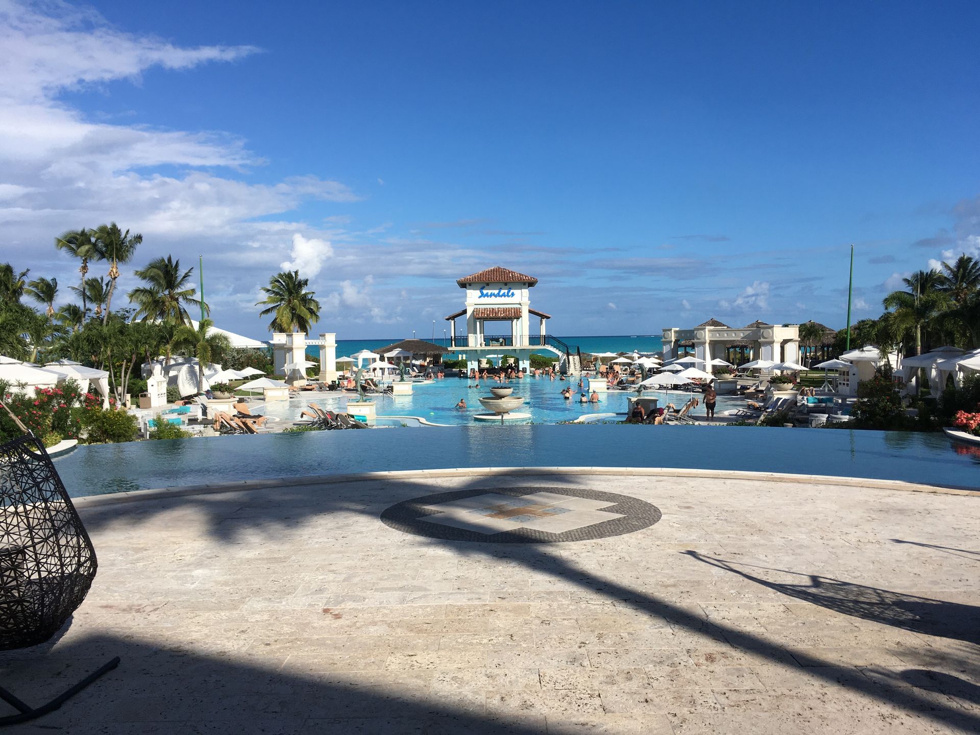 There is a large swimming pool in the middle of the resort.