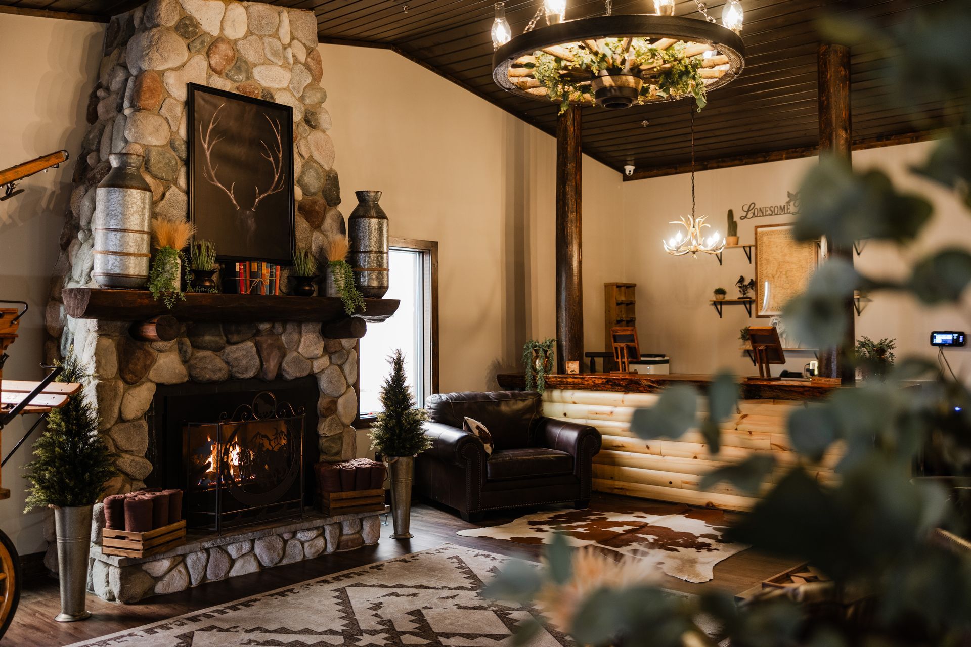 A living room with a fireplace and a chandelier.