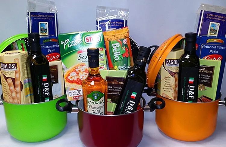 Three pots filled with food including a bottle of bello