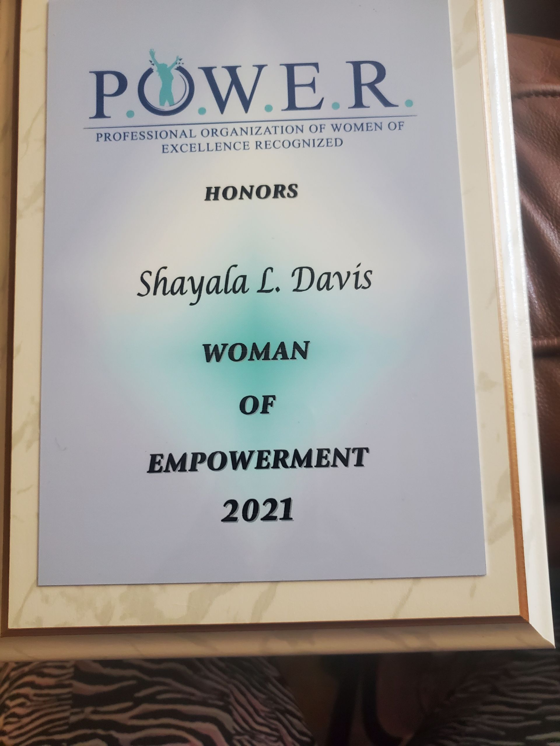 A plaque that says power honors shayala l davis