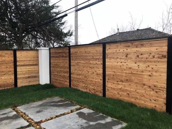 Fence Repair - Custom Slatted Fencing in a Backyard in Oklahoma City, OK