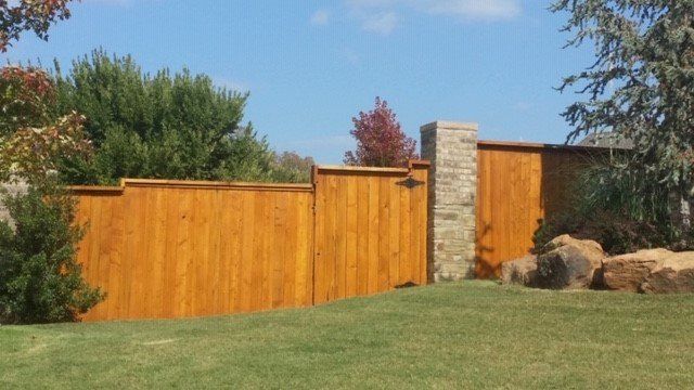 Affordable Fence Installation - Wooden Fence in a Backyard in Oklahoma City, OK