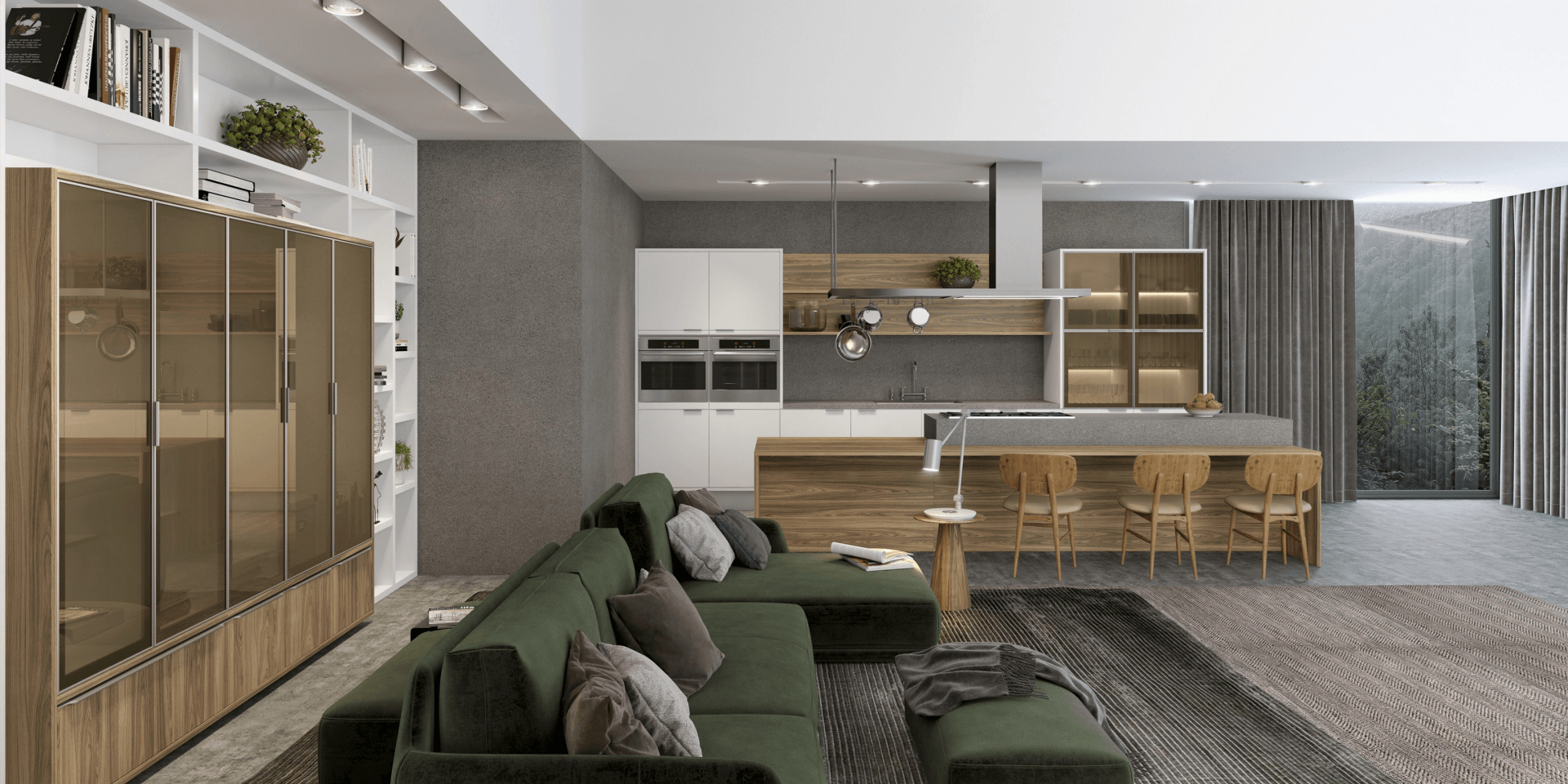 Una sala de estar con un sofá verde y una cocina al fondo.