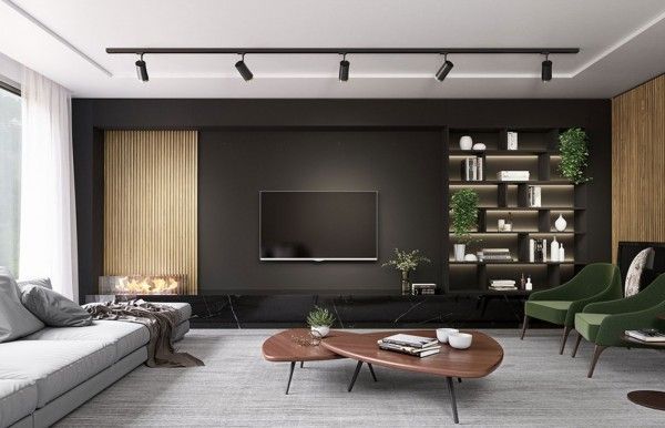 Una sala de estar con un televisor de pantalla plana en la pared.