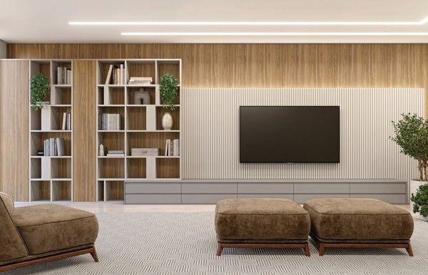 Una sala de estar con un televisor de pantalla plana en la pared.