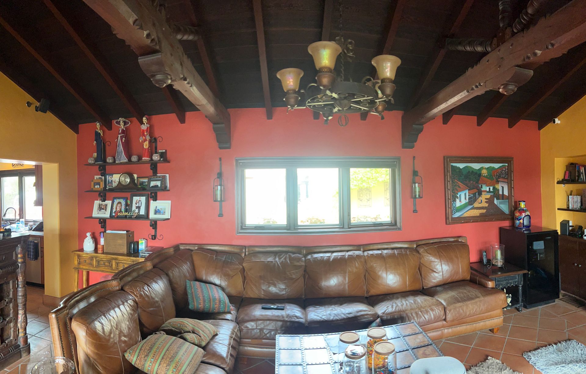 A living room with a couch and a chandelier